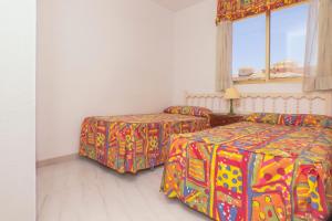 Ein Bett oder Betten in einem Zimmer der Unterkunft Torre Riviera