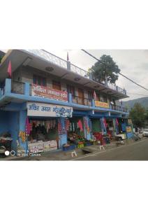 a building on the side of a street at StayApart - Hari Keshari Home Stay in Gopeshwar