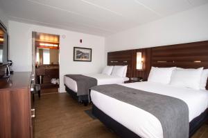 Postel nebo postele na pokoji v ubytování Crosswinds Motel + 12 fotografií