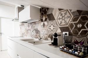 Kuchyň nebo kuchyňský kout v ubytování B&B - Uva Residence + 17 fotografií