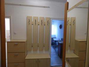 a dressing room with lockers and a desk at Bega Apartman in Barcs