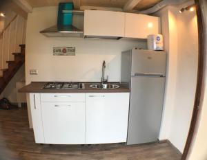 Kuchyňa alebo kuchynka v ubytovaní villetta san teodoro IUN Q7135