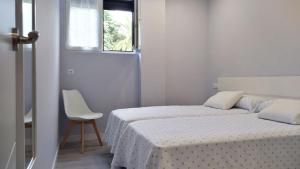 A bed or beds in a room at Apartamento los Acantilados Nº 2 Cobreces