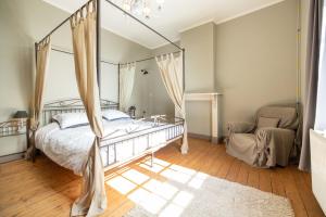 Кровать или кровати в номере de Oude Brouwerij