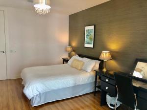 Vuode tai vuoteita majoituspaikassa CK Serviced Apartments Belfast