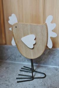 a wooden bird chair sitting on top of a counter at Loch Cromore Holiday Pods in Cromore