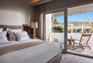 Cama ou camas em um quarto em Palladium Hotel