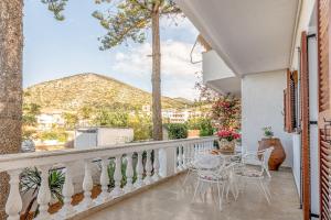 a balcony with a table and chairs and a view at Gaia Residence in Hersonissos