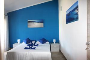 Postel nebo postele na pokoji v ubytování B&b Ajo' a mulinu Teulada