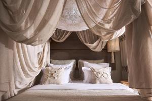 Cama ou camas em um quarto em Palladium Hotel