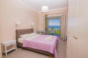 A bed or beds in a room at Nefeli