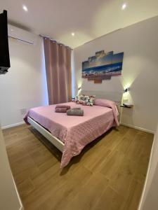 A bed or beds in a room at Le Calette 105