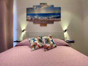 A bed or beds in a room at Le Calette 105
