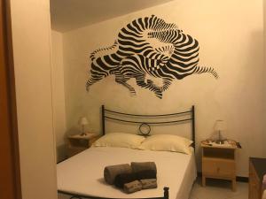Postel nebo postele na pokoji v ubytování villa Orchidee Sardegna