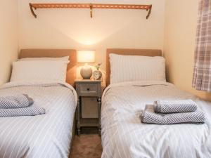 Postel nebo postele na pokoji v ubytování The Owl Barn