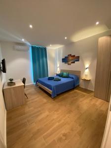 A bed or beds in a room at Le Calette 105