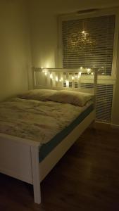 Posteľ alebo postele v izbe v ubytovaní Apartament Zamkowy