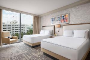 a hotel room with two beds and a window at InterContinental San Diego by IHG in San Diego