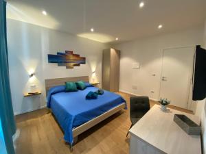 Ένα ή περισσότερα κρεβάτια σε δωμάτιο στο Le Calette 105