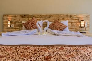 Postel nebo postele na pokoji v ubytování Hotel Niki