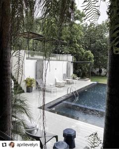 a house with a swimming pool in a yard at Manita Boutique Hotel in Pattaya South