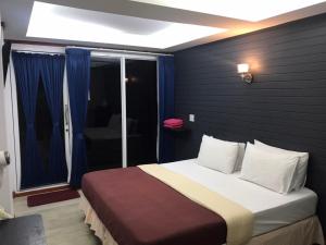 Postel nebo postele na pokoji v ubytování Sinsamut Koh Samed