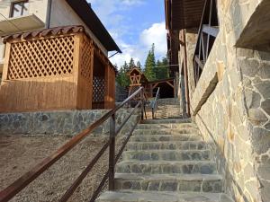 a set of stairs leading up to a building at Brand NEW 2020 specious apartments DRUZI 3 in Bukovel