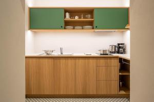 A kitchen or kitchenette at Ladurnerhof Boutique Apartments Meran