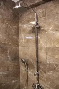 a shower with a glass door in a bathroom at Alâ Avsa Hotel in Avşa Adası +74 photos