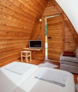 Postel nebo postele na pokoji v ubytování I Larici Camping Lodge + 13 fotografií