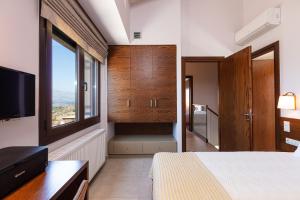 Katil atau katil-katil dalam bilik di Villa Galanis