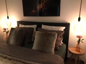 Ένα ή περισσότερα κρεβάτια σε δωμάτιο στο Luxe Natuurhuisje met jacuzzi en haard in Drenthe, ECHTEN