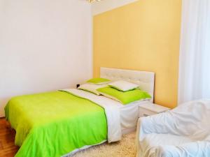 A bed or beds in a room at Júlia Vendégház