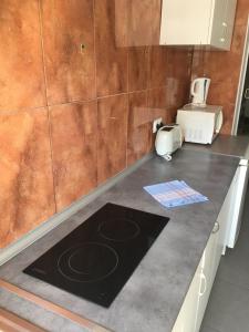 a kitchen counter top with a toaster and a toaster at BERMUDAS-TURIS Apartamentos in Benidorm