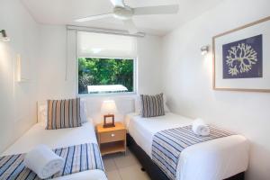 a hotel room with a bed and a desk at Maison Noosa in Noosa Heads