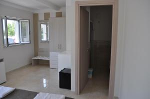 a white bathroom with a sink and a shower at Villa Angela in Scalea +51 photos