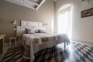 a bedroom with a large bed in a room at La corte dei tre in Torre del Lago Puccini
