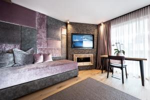 Televiisor ja/või meelelahutuskeskus majutusasutuses Hotel Arkadia - "Adults Only"