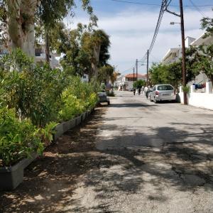 a street with a car parked on the side of the road at Nea Stira Studios Kondilia in Nea Stira