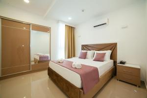 Ένα ή περισσότερα κρεβάτια σε δωμάτιο στο Hotel Ambiente Ulcinj