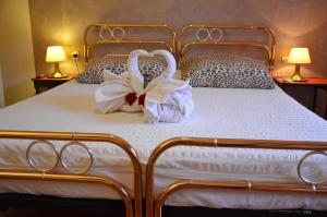 Postel nebo postele na pokoji v ubytování B&B Villa Olmo