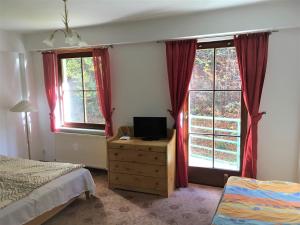 Postel nebo postele na pokoji v ubytování Apartmany Jachymov