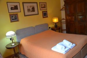 Postel nebo postele na pokoji v ubytování B&B Villa Olmo