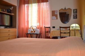Postel nebo postele na pokoji v ubytování B&B Villa Olmo