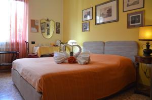 Postel nebo postele na pokoji v ubytování B&B Villa Olmo