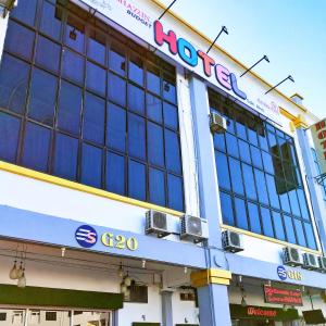 a hooters sign on the front of a building at Ghazrin's Garuda Hotel in Johor Bahru