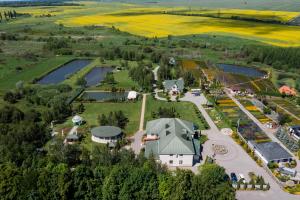 an aerial view of a farm with a large building at Рестпарк рекреаційний комплекс in Luts'k