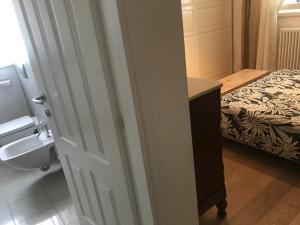 Postel nebo postele na pokoji v ubytování camera con bagno privato e parcheggio