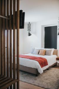 מיטה או מיטות בחדר ב-O Cantinho dos Cabrais