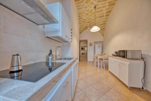 A kitchen or kitchenette at Corte Anibaldi Apartment
